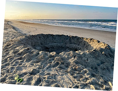 Hole in beach is hazardous to people and sea turtles