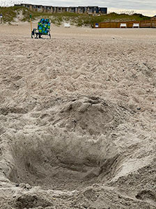 Large holes like this one should be filled in before leaving the beach.